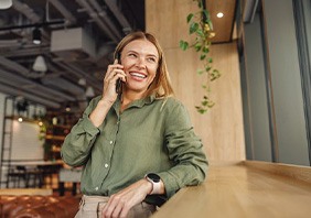 Lady schedules her consultation for implants over the phone