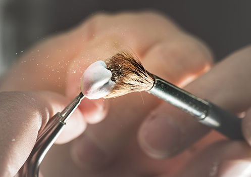 Close up of dental crown being polished