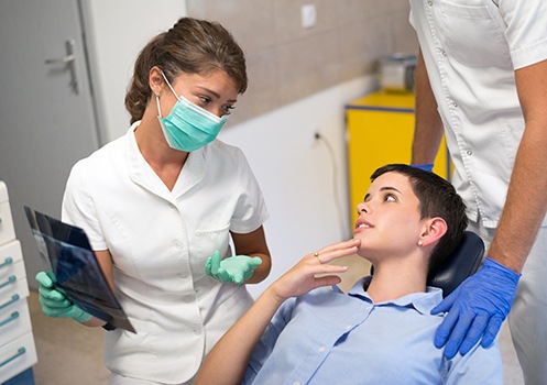 Dentist in Conyers reviewing gum disease treatment options with a patient 