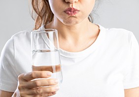 A woman gargling saltwater