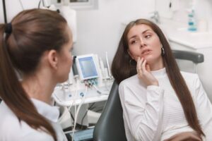Woman at her emergency dentist with a sudden toothache
