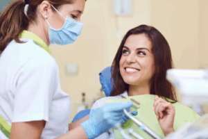 a dentist about to place a dental crown