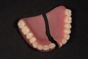 A broken denture on a table